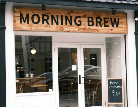 Generated coffee shop storefront with a MORNING BREW sign and a chalkboard: Studio Vision v3